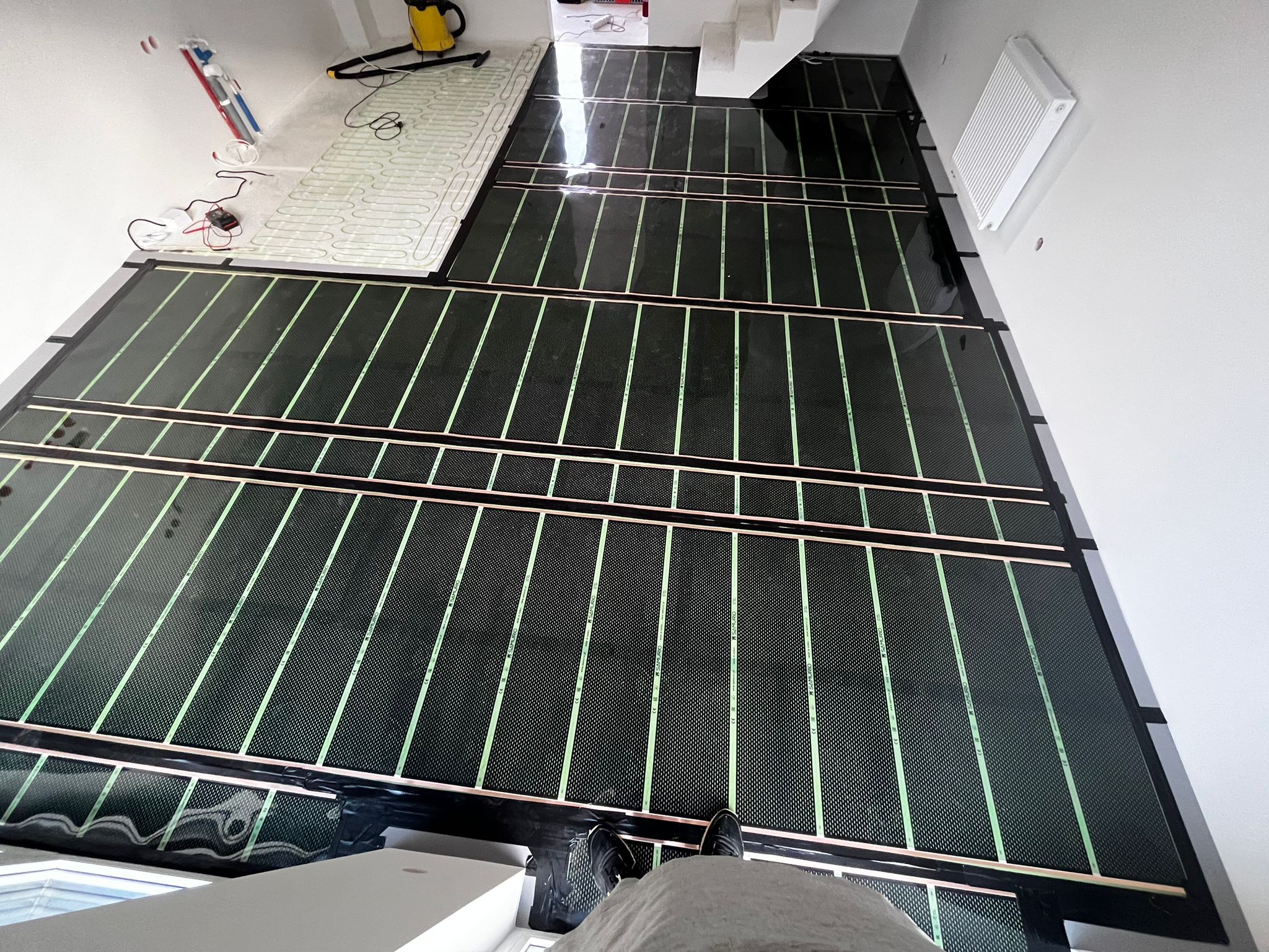 Folie i maty grzewcze w mieszkaniu w Słominie