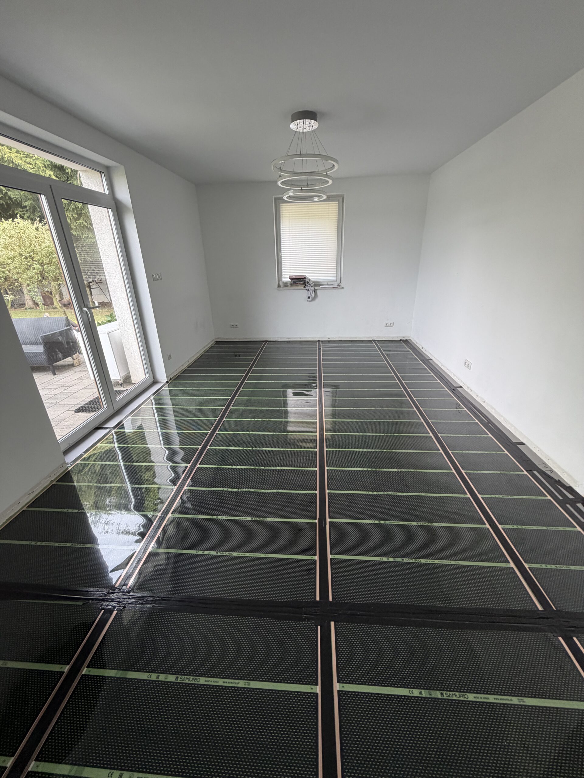 Ogrzewanie foliami grzewczymi w domu 100 m² w WełtyniuOgrzewanie foliami grzewczymi w domu 100 m² w Wełtyniu