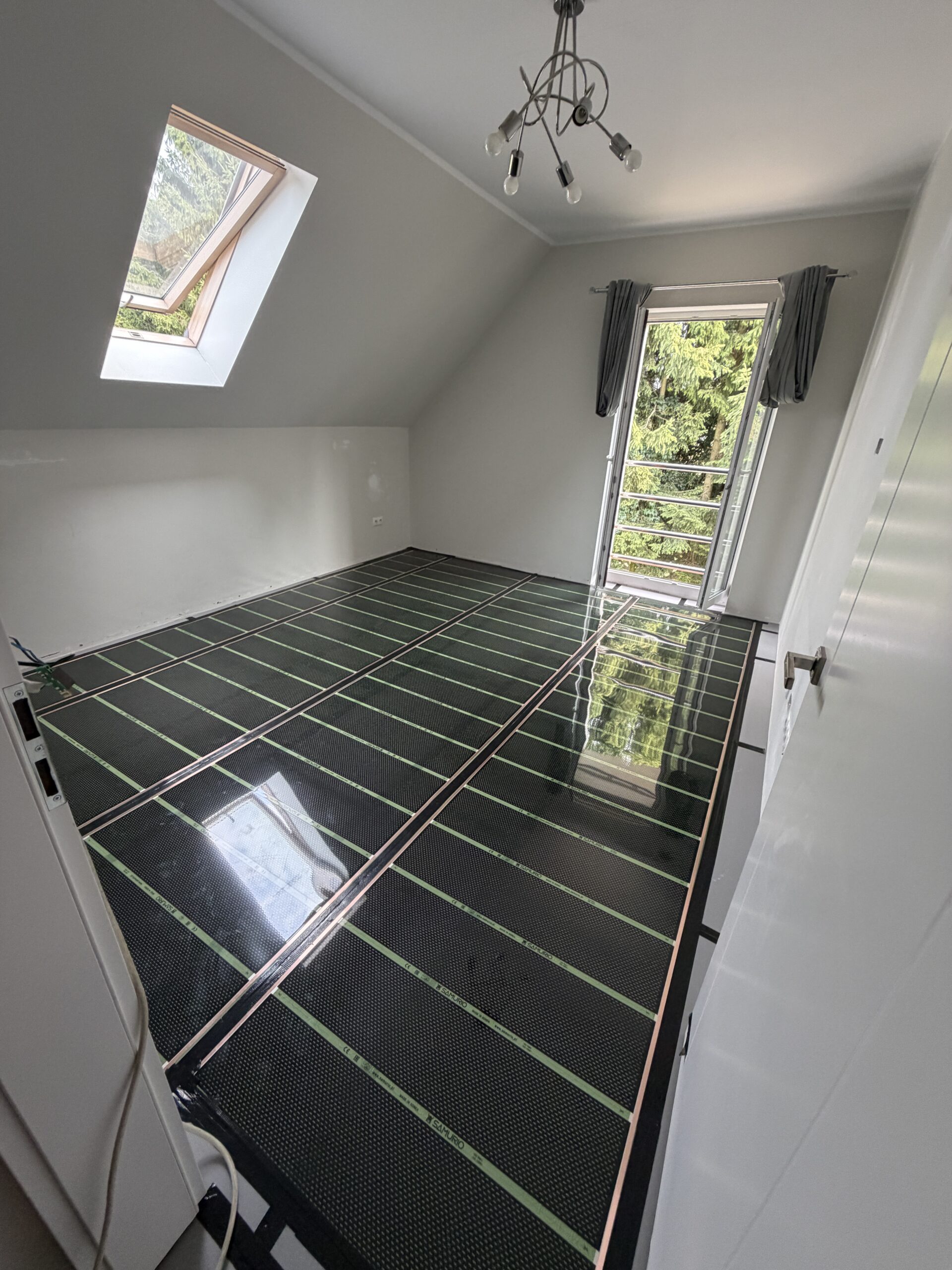 Ogrzewanie foliami grzewczymi w domu 100 m² w Wełtyniu