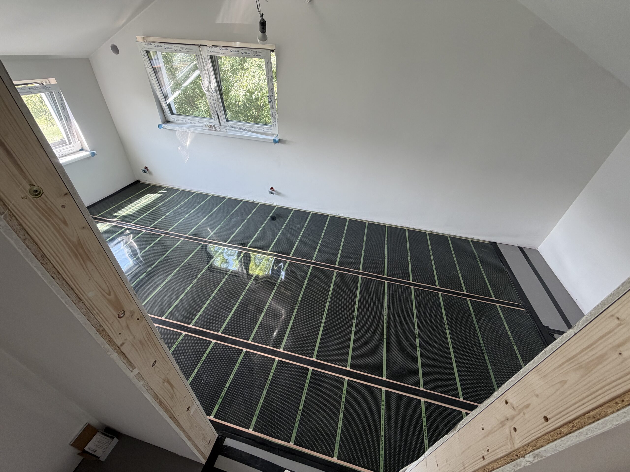 Ogrzewanie foliami i matami grzewczymi w domu 70 m² w Nadmie