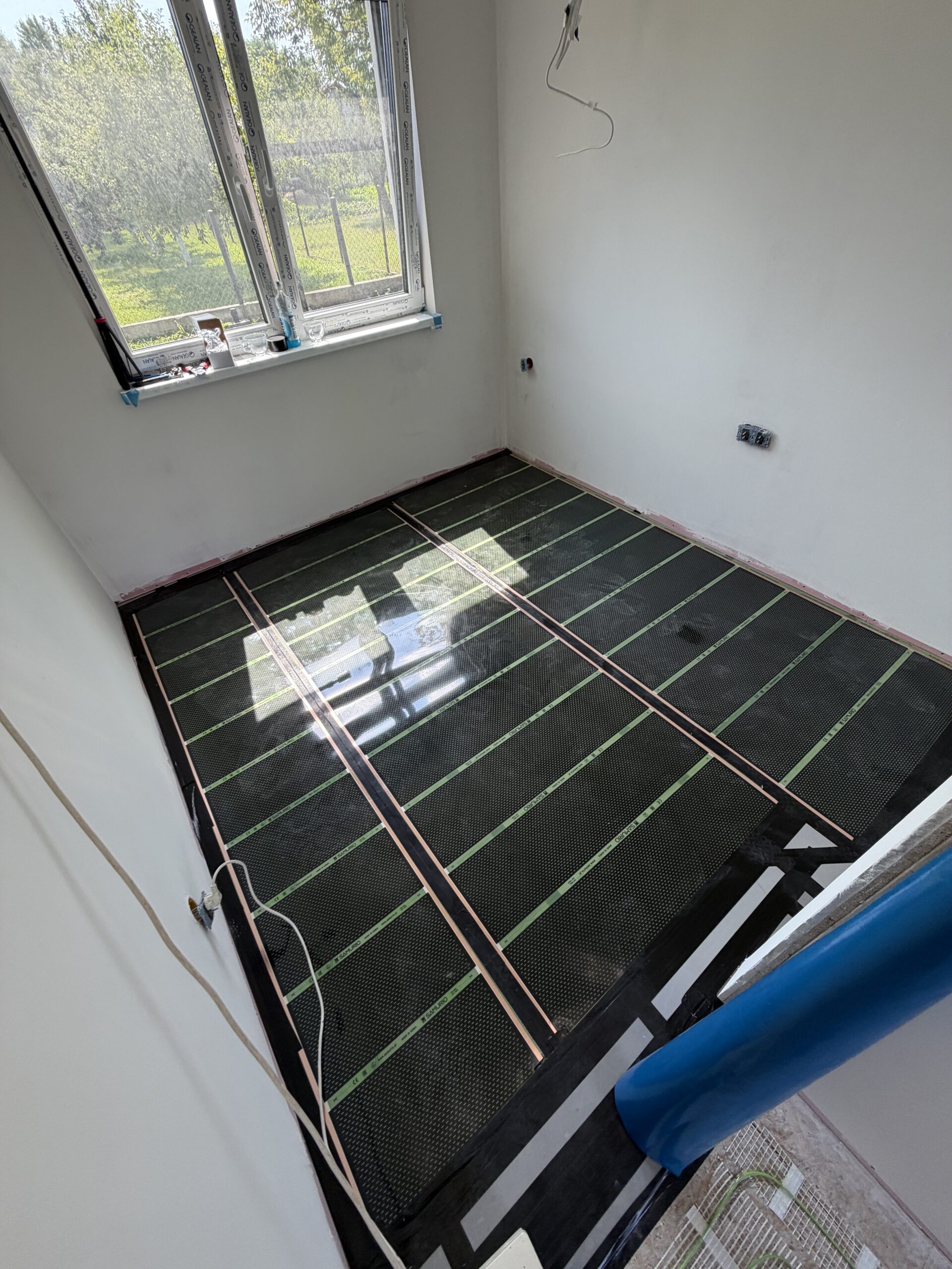 Ogrzewanie foliami i matami grzewczymi w domu 70 m² w Nadmie